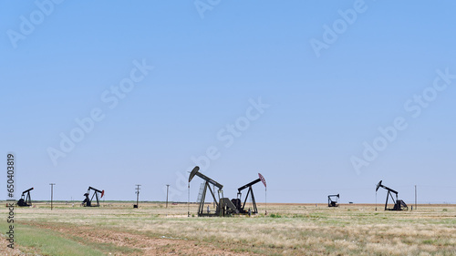 MIDLAND, TEXAS/USA - JULY 4th 2023: oil rig fields. a road trip of a family with a teenage girl during her school summer break before the start of the senior year. photo