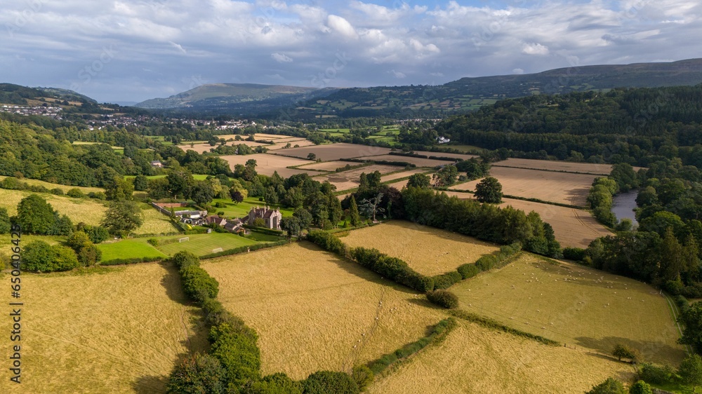 Naklejka premium Aerial view of the Welsh countryside with mountains in the distance