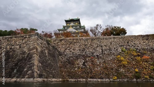 Low angle of the Osaka Castle Main Toweron a fortress in Japan photo