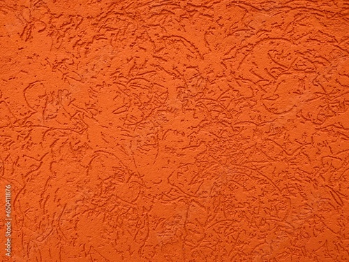 background of a decorative orange wall with embossing