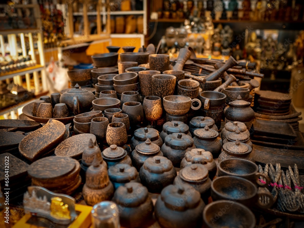many small objects are on a table in a market room many small objects are on a table in a market room