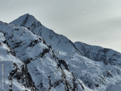 Scenic view of a snow-capped mountain range in Swiss Alps in winter
