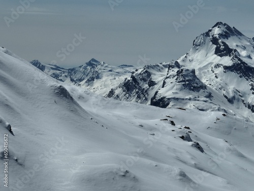 Scenic view of a snow-capped mountain range in Swiss Alps in winter © Nelior/Wirestock Creators