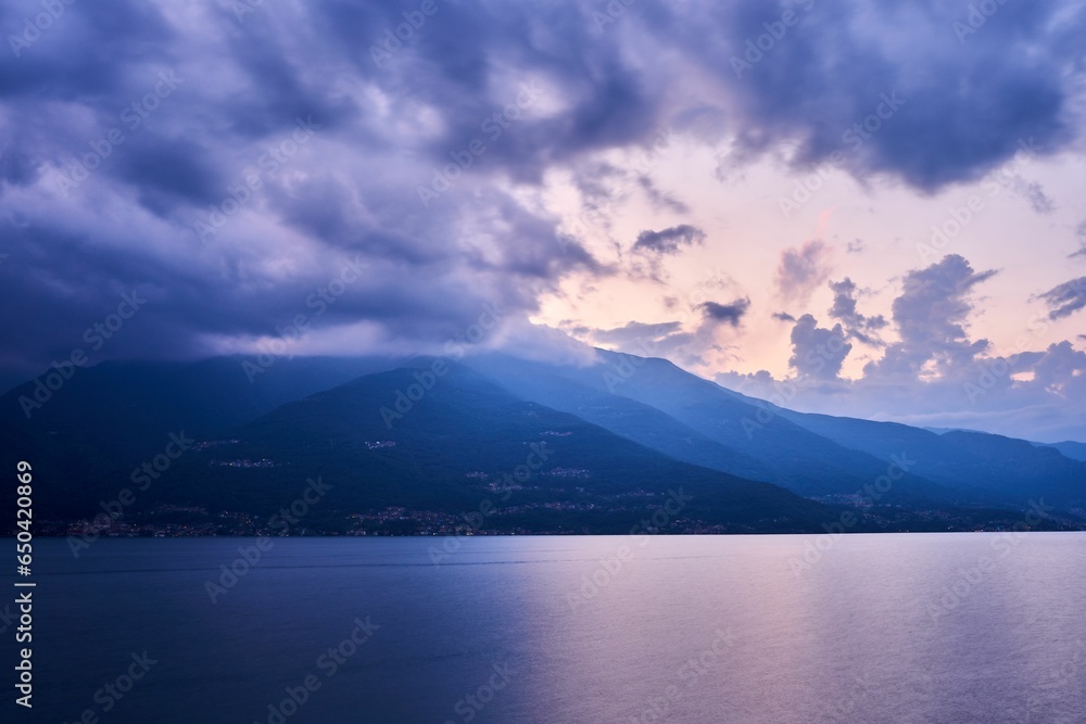 Beautiful shot of a sunset sky over Lake Como and nearby mountains