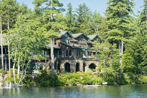 Fototapeta Naklejka Na Ścianę i Meble -  Picturesque lake house in front of the peaceful waters of Lake Winnipesaukee, New Hampshire