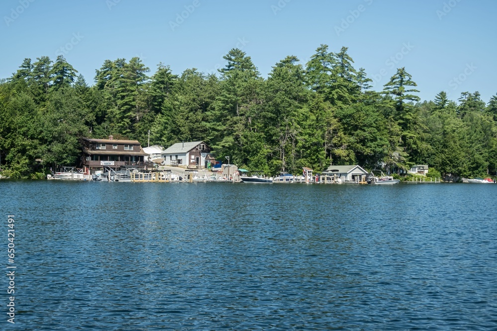 Picturesque lake house in front of the peaceful waters of Lake Winnipesaukee, New Hampshire Picturesque lake house in front of the peaceful waters of Lake Winnipesaukee, New Hampshire