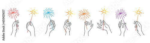 Sparklers in human hands.