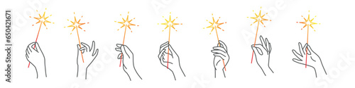 Sparklers in human hands.