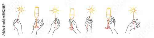 Hands hold champagne and sparklers.