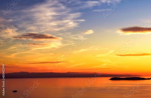 Golden hour, wonderful sky with colorful clouds in Aegean sea, Greece.