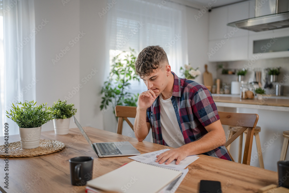 Young caucasian man teenager student study at home