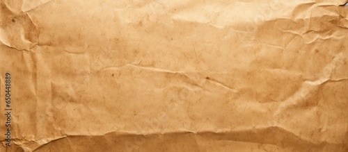 Recyclable organic paper bag with creased craft texture and light brown color used as background photo