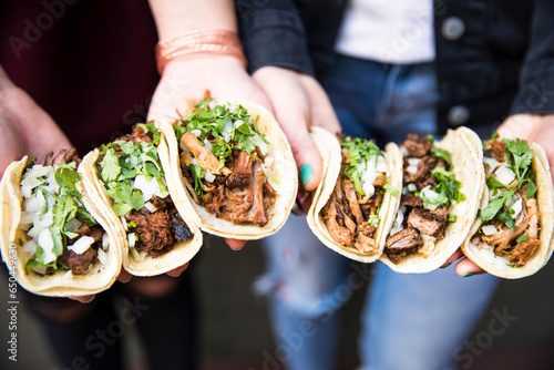 Hands Holding Tacos 2 photo