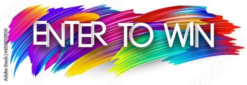 Enter to win paper word sign with colorful spectrum paint brush strokes over white.