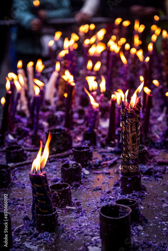 group of handmade and ornamental candles lit by the Lord of Miracles in Lima, Peru