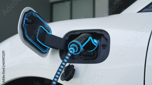 Electric car plugged in with home charging station to recharge battery by EV charger cable. Future innovative EV car and energy sustainability. Smart and futuristic home energy infrastructure. Peruse