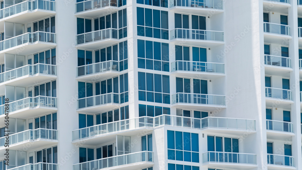 Snapshot of High-Rise Apartment Exterior Renovation With Natural Stone And Glass