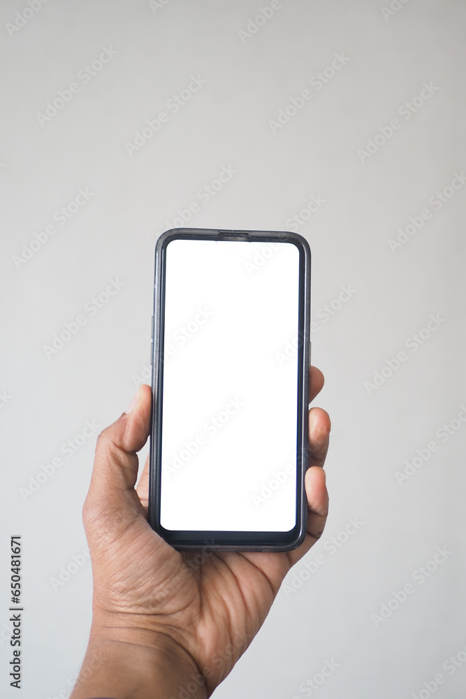 pov shot of f young man hand using smart phone with empty screen pov shot of f young man hand using smart phone with empty screen