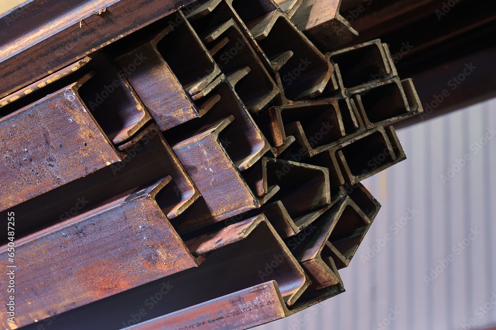 Rusty channel beams stack in non heating plant warehouse Rusty channel beams stack in non heating plant warehouse