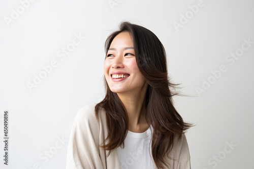 Happiness Asian Japanese woman with beautiful long hair looking slightly and making a gentle smile isolated on white background created with Generative AI Technology © AstraNova