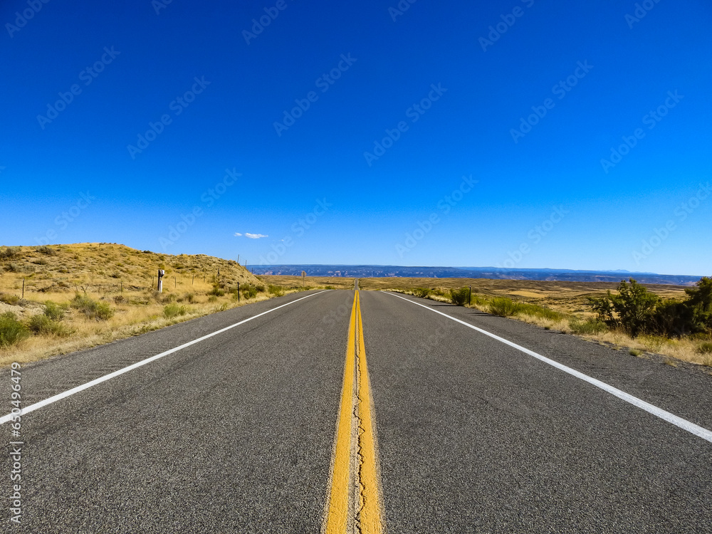Long Straight Back Roads Highway into the Distant Valley on the Horizon Long Straight Back Roads Highway into the Distant Valley on the Horizon