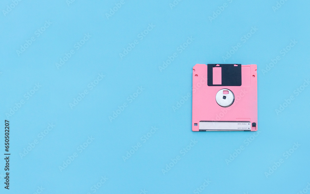 A floppy disk isolated on blue background. After some edits. A floppy disk isolated on blue background. After some edits.