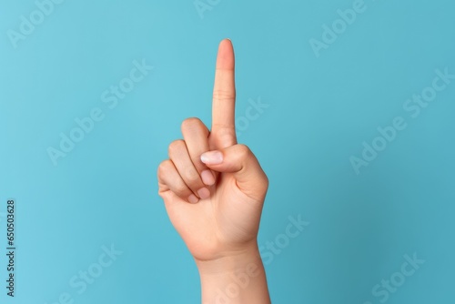 Female Hand with Red Manicure Showing index finger on Blue Background  Generative AI