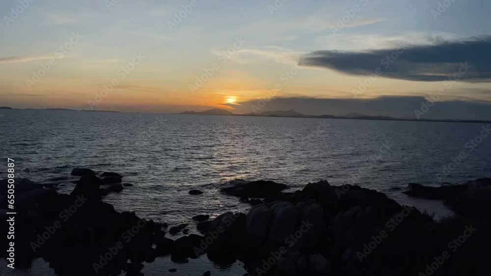 Sunset time lapse the sun goes down, blue and orange clouds flow in sky. Majestic summer landscape. Romantic colorful sunset at the sea. Sunset time lapse the sun goes down, blue and orange clouds flow in sky. Majestic summer landscape. Romantic colorful sunset at the sea.