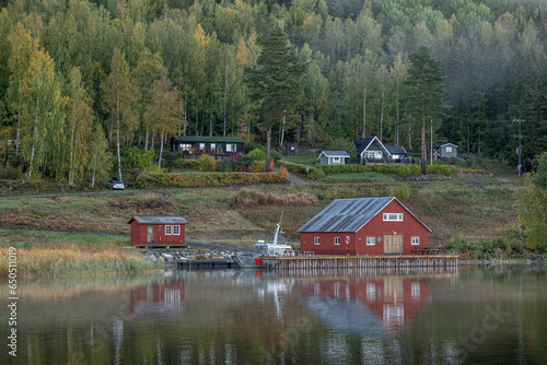 Swedish houses and mountain ant the sea at skuleberget campsite caravan camping in Hoga Kusten Sweden photo