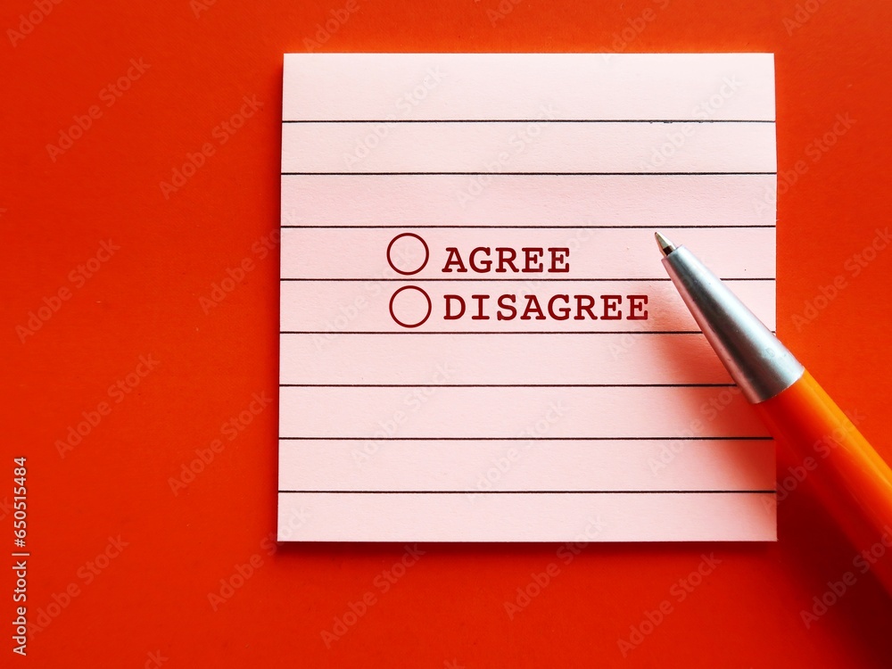 Pen on note pad with checklists AGREE and DISAGREE on orange background, concept of answer to question WHAT DO YOU THINK? and giving opinion, agreeing and disagreeing - obrazy, fototapety, plakaty 