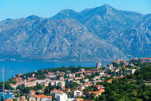 panoramic view of a small town and a bay with yachts against the backdrop of mountains and beautiful nature, Kotor city, Bay of Kotor, Montenegro 