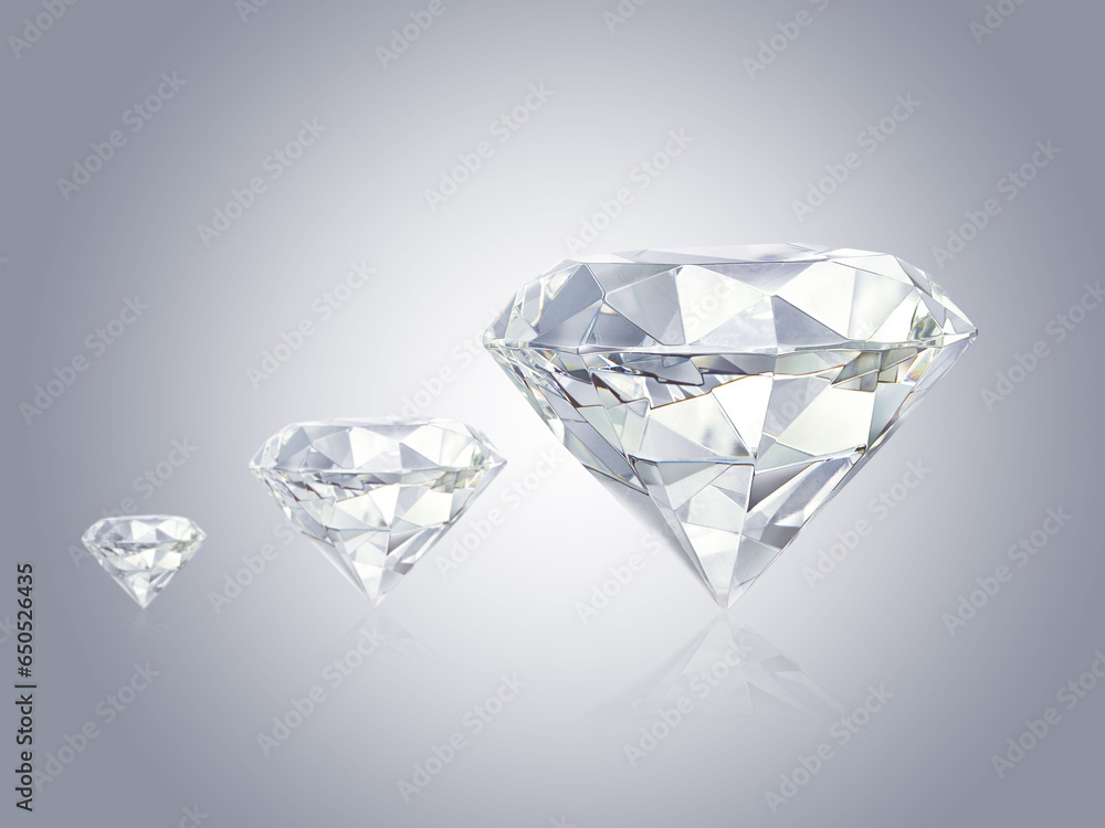 Three beautiful diamonds on a gray background Three beautiful diamonds on a gray background