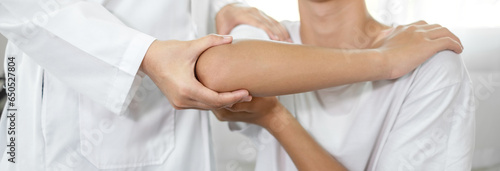 Female physiotherapists provide assistance to male patients with elbow injuries and examine patients in rehabilitation centers. Physiotherapy concepts