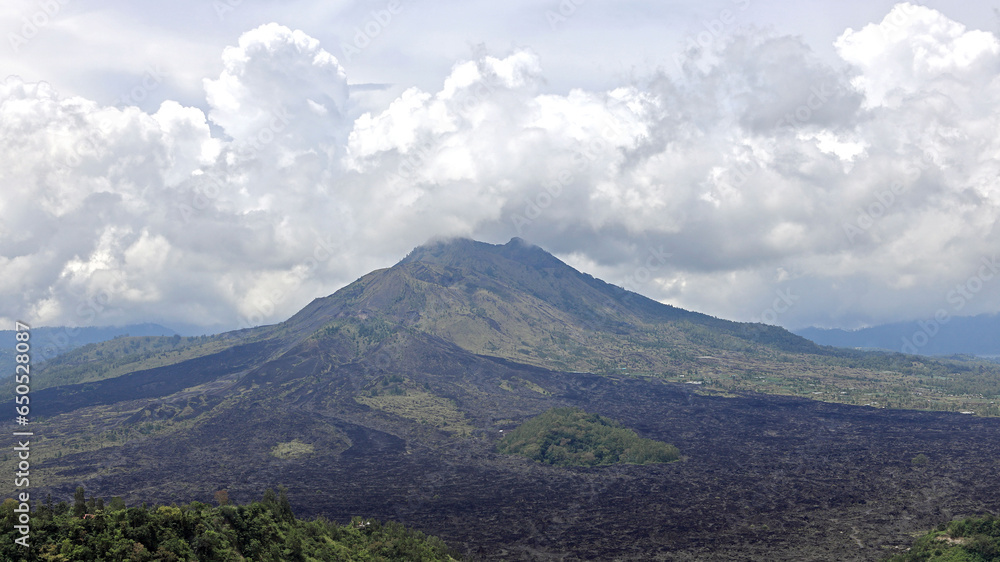 Panoramic view of Mount Batur mountain in Bali. It is an active volcano situated at the center of two concentric calderas.