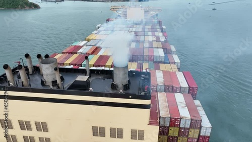 Smoke exhaust gas emissions carbondioxide from cargo lagre ship container ship,Marine diesel engine exhaust gas from combustion, Gas Emission Air Pollution from transportation. green house effect Eco. photo