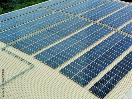 Solar cells on roof or terrace with sun light, Can saving energy. Sun or renewable or Clean energy.. Solar panels on the roof of a factory building