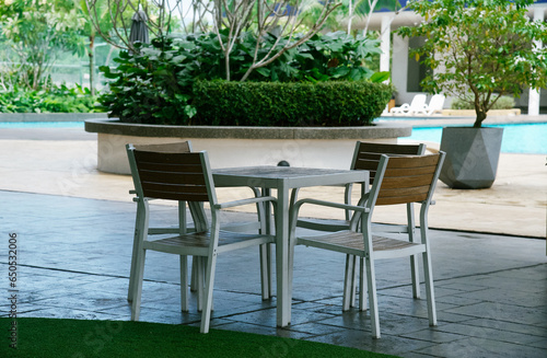 table and chair in the garden, outdoor furniture concept, selective focus