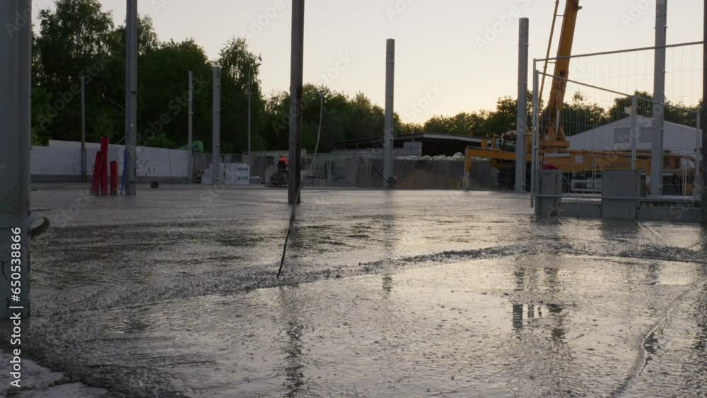 Wet Concrete Slab Flooring At The Construction Site During Sunset. - wide Wet Concrete Slab Flooring At The Construction Site During Sunset. - wide