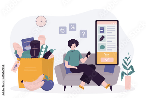 Customer woman sitting at home and using cellphone, ordering food in mobile application. Online food shopping by mobile phone. Food and grocery goods,