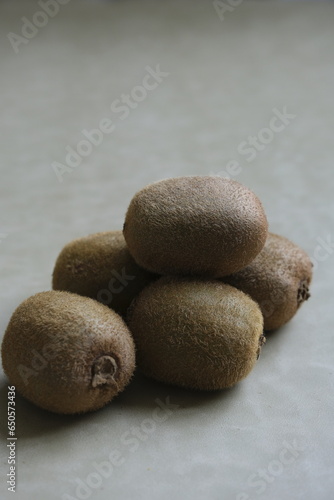 Isolated Kiwi or Gosberi china on gray background. Actinidia deliciosa photo