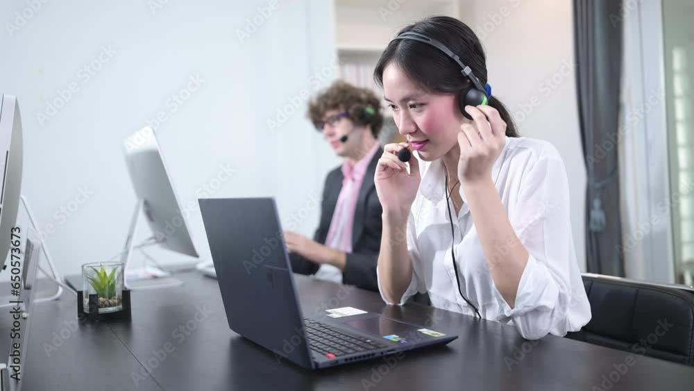 Group of business people wearing headset working actively in office. Call center, telemarketing, customer support agent provide service on telephone video conference call. Group of business people wearing headset working actively in office. Call center, telemarketing, customer support agent provide service on telephone video conference call.