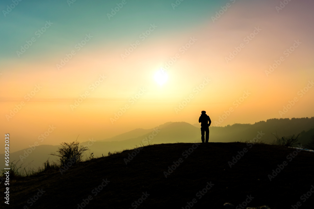 Person backlit, looking towards the sky. Contemplation, solitude, single.
Person backlit, looking towards the sky. Contemplation, solitude, single.
