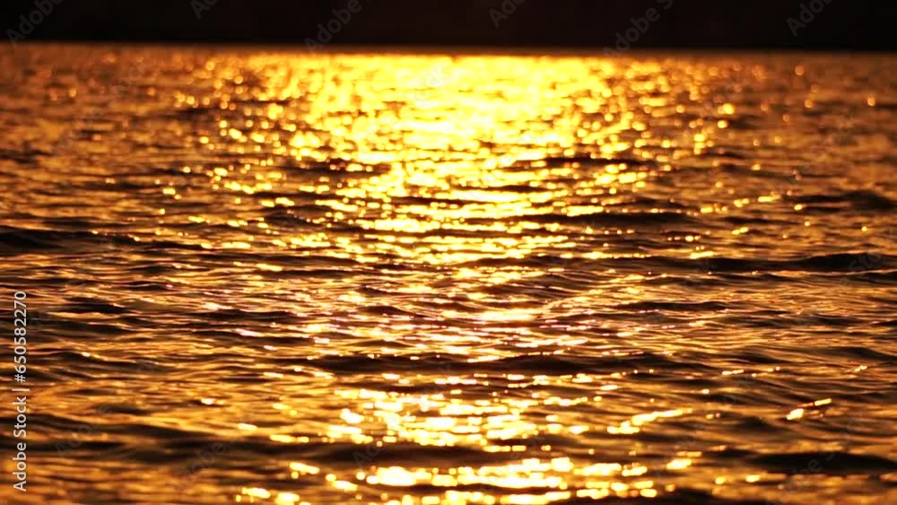 Sea water surface. Low angle view over clear azure sea water. Sun glare. Abstract nautical summer ocean nature. Holiday, vacation and travel concept. Nobody. Slow motion. Weather and climate change Sea water surface. Low angle view over clear azure sea water. Sun glare. Abstract nautical summer ocean nature. Holiday, vacation and travel concept. Nobody. Slow motion. Weather and climate change