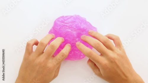 Asmr. A game of stretching and squeezing hands, soft, sticky colored slime.  photo