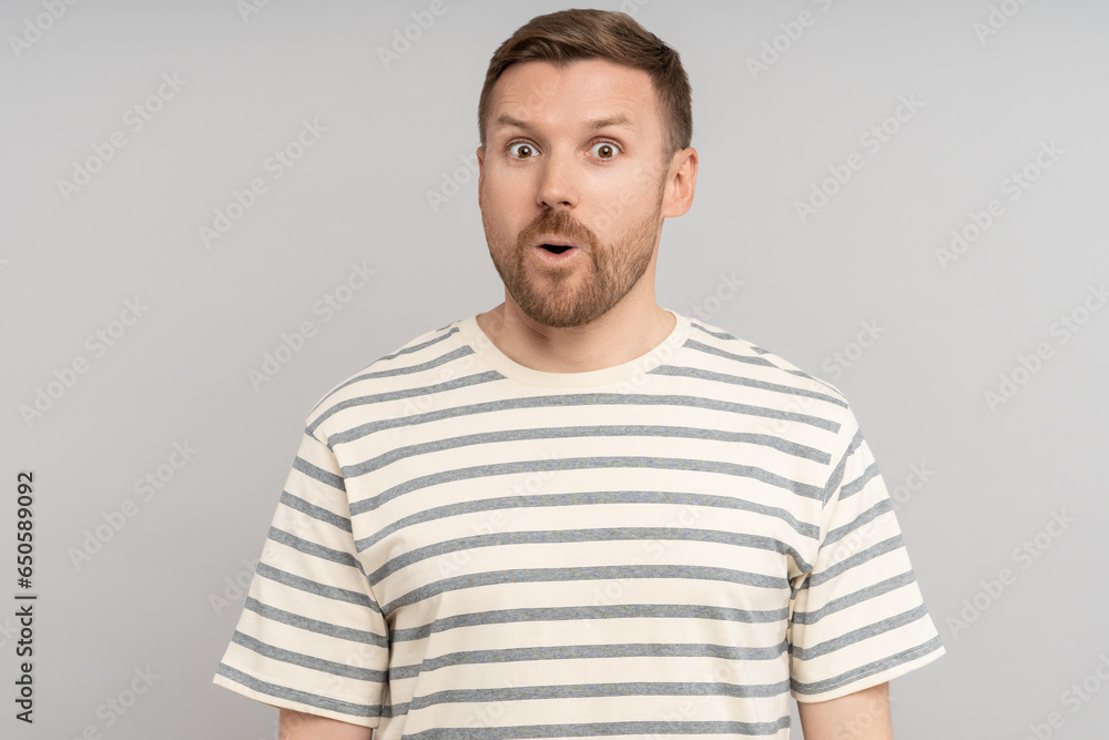 Astonished man looking open mouth in amazement, omg, surprised from ad offer opportunity. Shocked middle aged caucasian male with excited expression round eyes, isolated studio background. Omg, wow Astonished man looking open mouth in amazement, omg, surprised from ad offer opportunity. Shocked middle aged caucasian male with excited expression round eyes, isolated studio background. Omg, wow