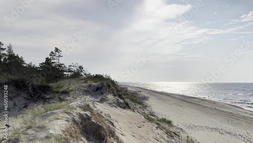 A peaceful day in Latvia, Ventspls, at Baltic Sea beach. Windy, sunny, relaxing day with a view of the sea, dunes, beach, and forest.