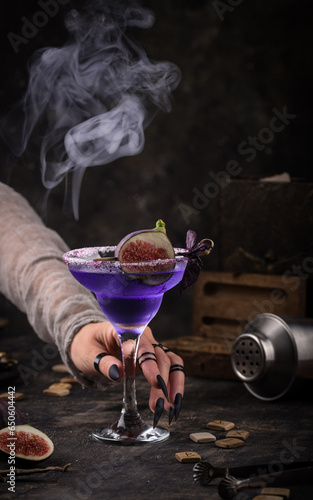 Purple fig cocktail or mocktail in glass photo