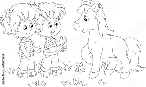 Little boy and girl treating a cute small foal with tasty cookies, black and white outline vector cartoon illustration for a coloring book