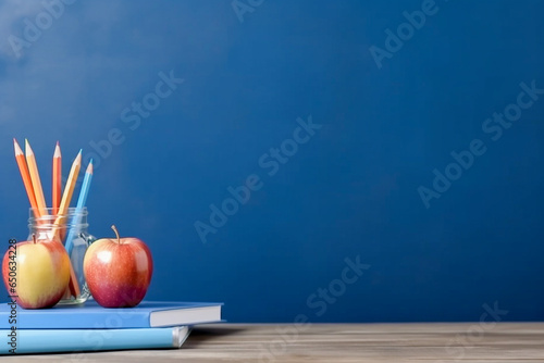 Ready for school concept background with books  alarm clock and accessory.