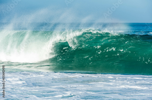big wave washing up on the beach